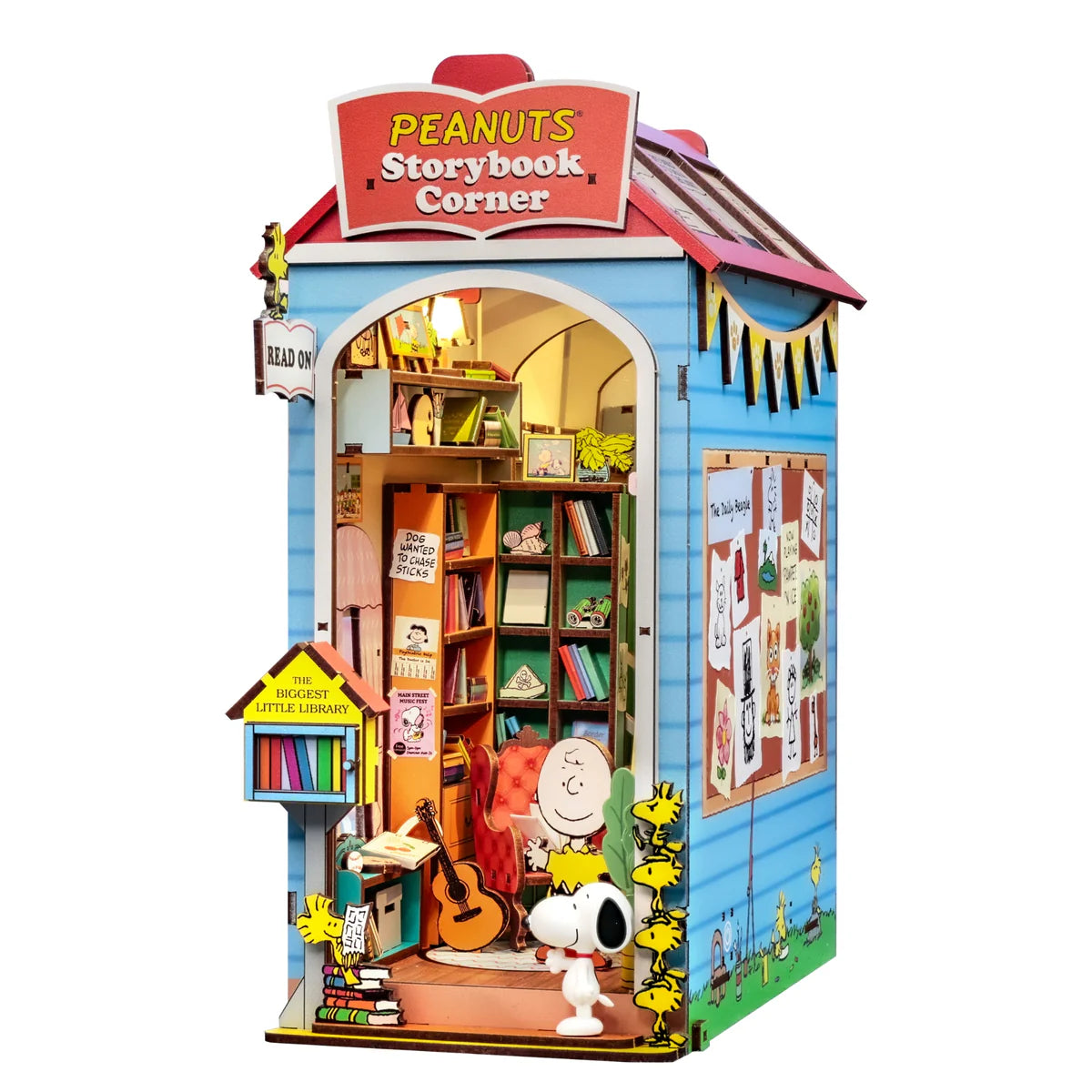 Peanuts Storybook Corner Booknook: Detailed diorama featuring Snoopy, Woodstocks, and Charlie Brown in a tiny reading nook with bookshelves and a book box.