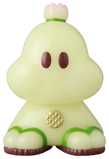 VAG Series 44 Ushimitsu Waranin: A chibi-style, 2.5-inch vinyl plant figurine with reddish-brown eyes, stubby limbs, and a flower bud on its head.