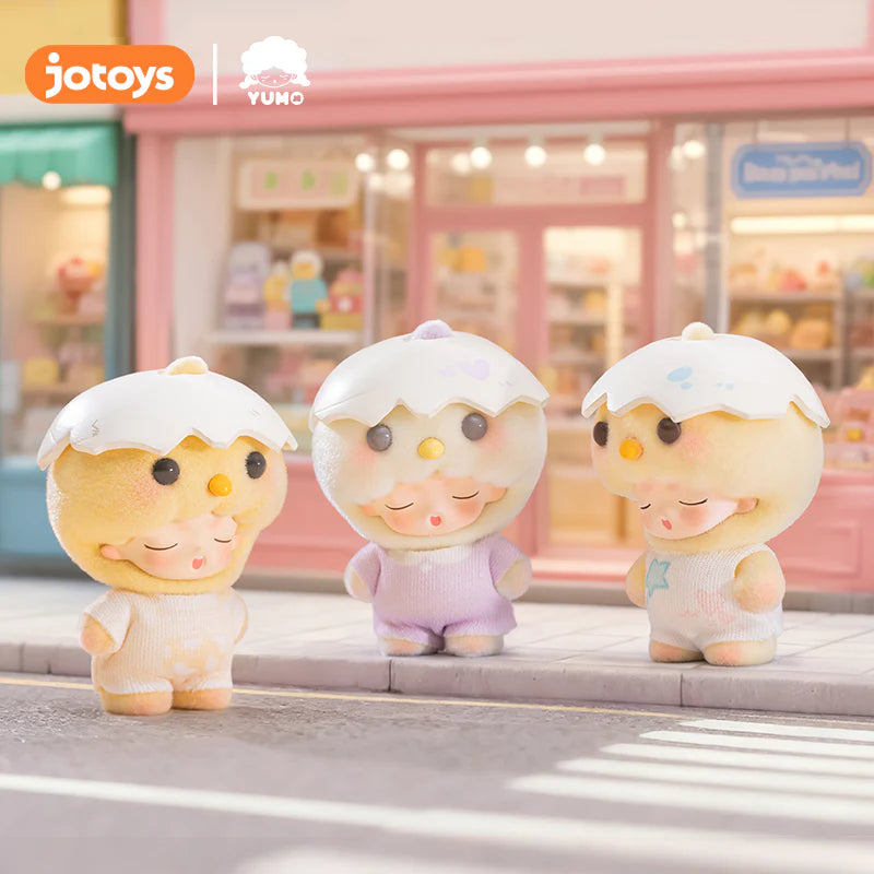 YUMO Cute Pet Family Mini Series figurines in pastel outfits with eggshell hats line a pink storefront, embodying Strangecat Toys' whimsical charm.