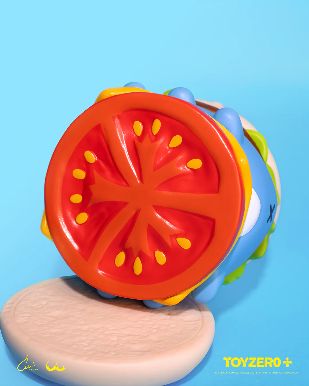 LuLu the Piggy x Capoo - LuLuBurger collectible, a stylized vinyl toy resembling a burger with detachable layers, featuring a tomato slice design, by TOYZERO+.