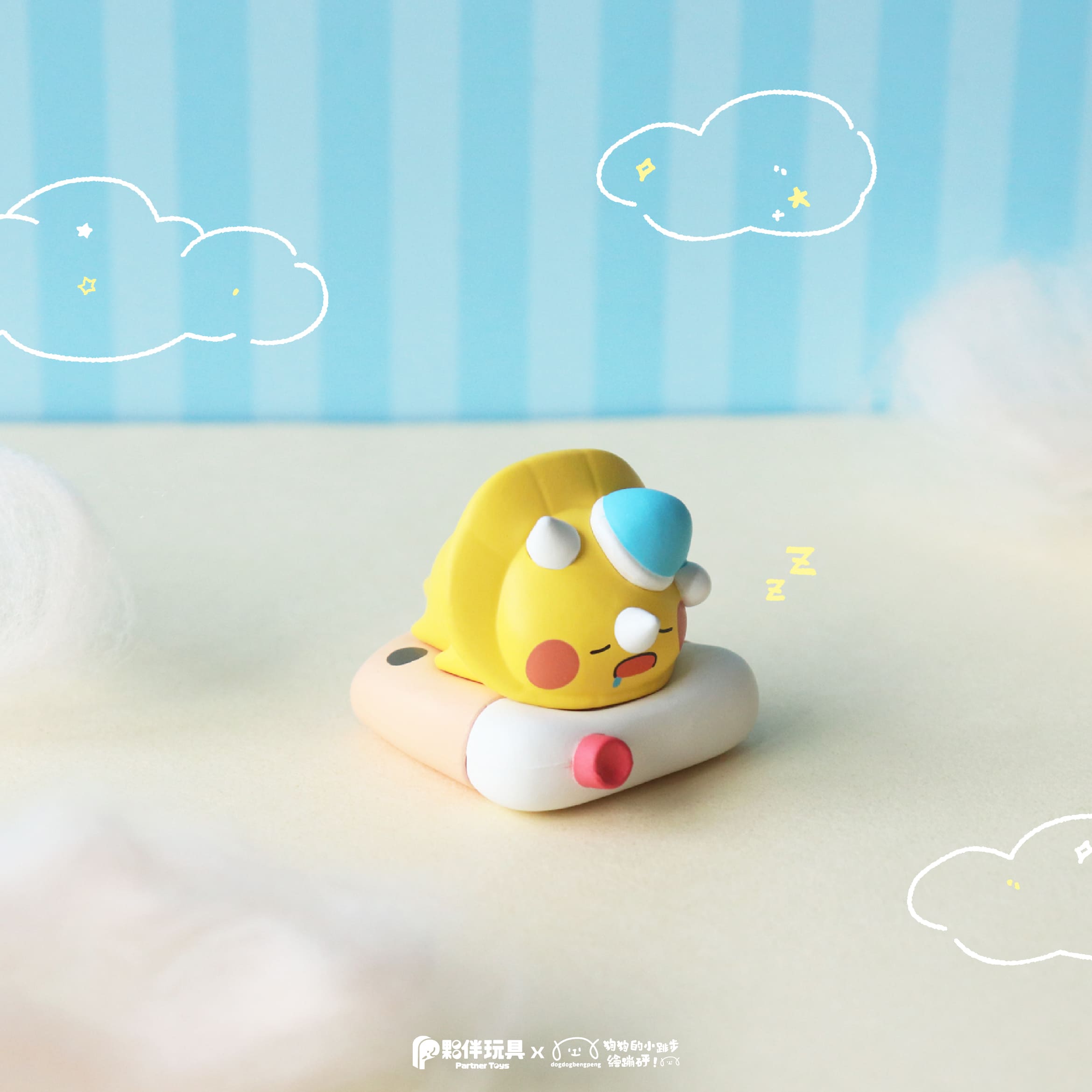 Foodie Dino Snoozy Blind Box: A whimsical yellow dinosaur figurine, dozing on a pastel float ring, wearing a blue sleeping cap, from Strangecat Toys' blind box series.