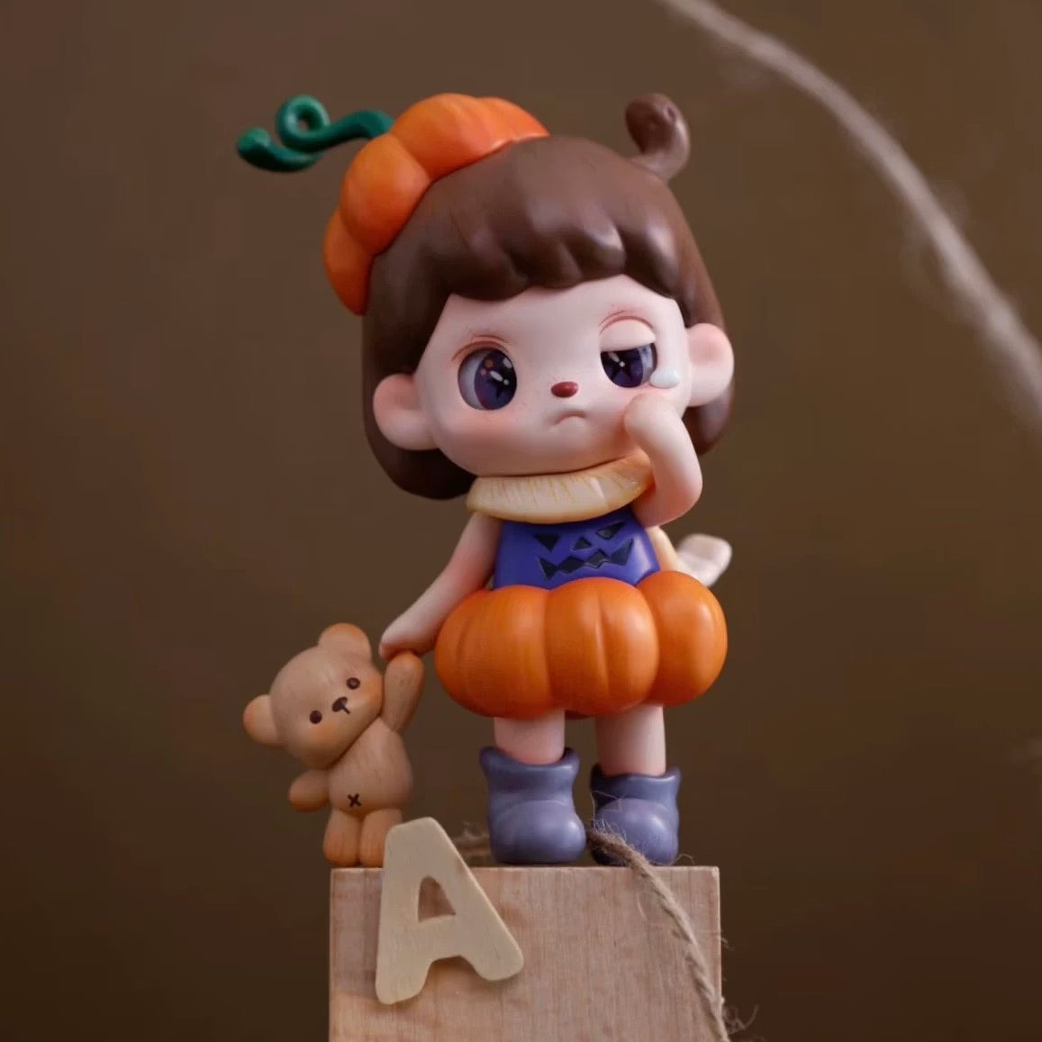 ANMOO Amo World is a Lie Fairy Tale Blind Box Series figurine, featuring a girl in a pumpkin outfit. Preorder for May 2025 release.