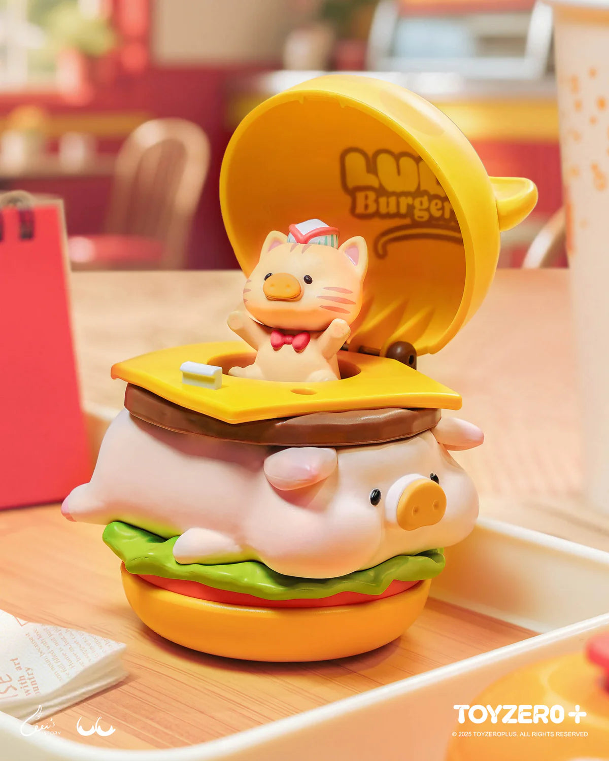 LuLu the Piggy - Burger Express Movable Series toy with a pop-up cat inside a cartoonish burger design, featuring interactive collectible elements.
