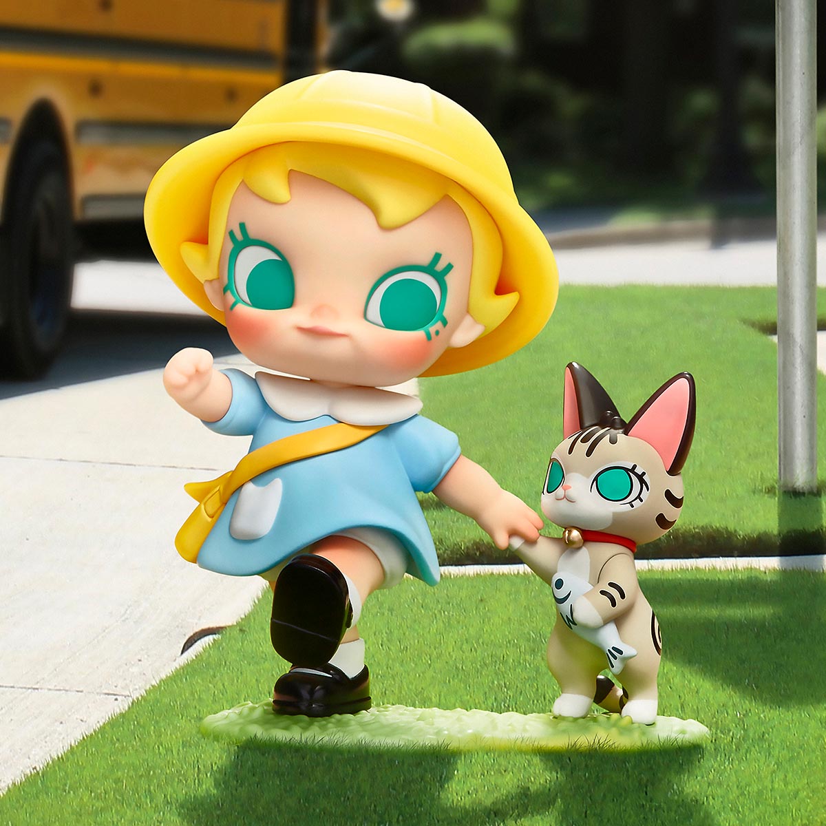 Baby Molly & Baby Tabby Series Figures: a stylized girl and kitten toy set, featuring oversized eyes and playful attire, stepping onto grass together.