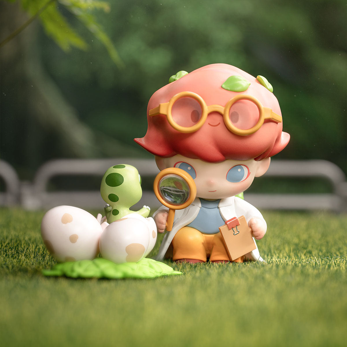 DIMOO Jurassic World Series - Preorder: A toy scientist examines a hatching dinosaur with a magnifying glass, embodying the playful spirit of Strangecat Toys.