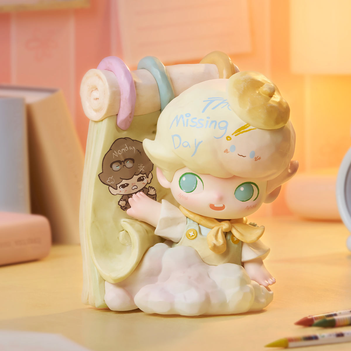 DIMOO The Missing Day Series chibi figurine on cloud base, with blond beret, yellow neckerchief, and Monday scroll backing, available for preorder at Strangecat Toys.