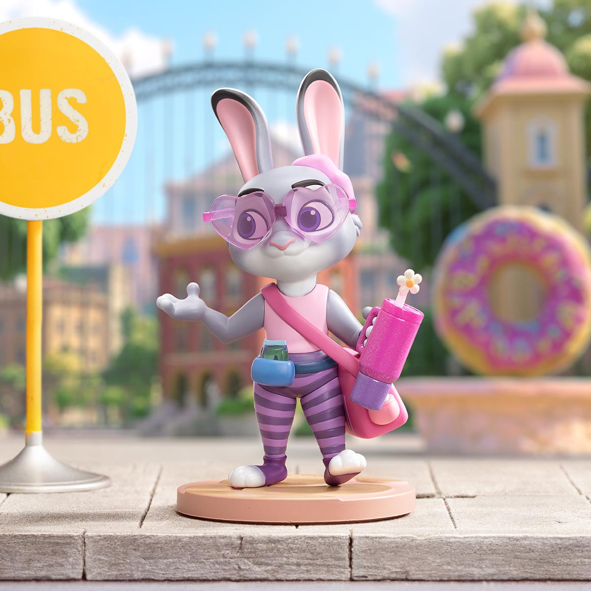 Disney Zootopia: Next Adventure Series Figure preorder, featuring a stylish anthropomorphic rabbit in urban attire, holding a glittery tumbler near a city bus stop.