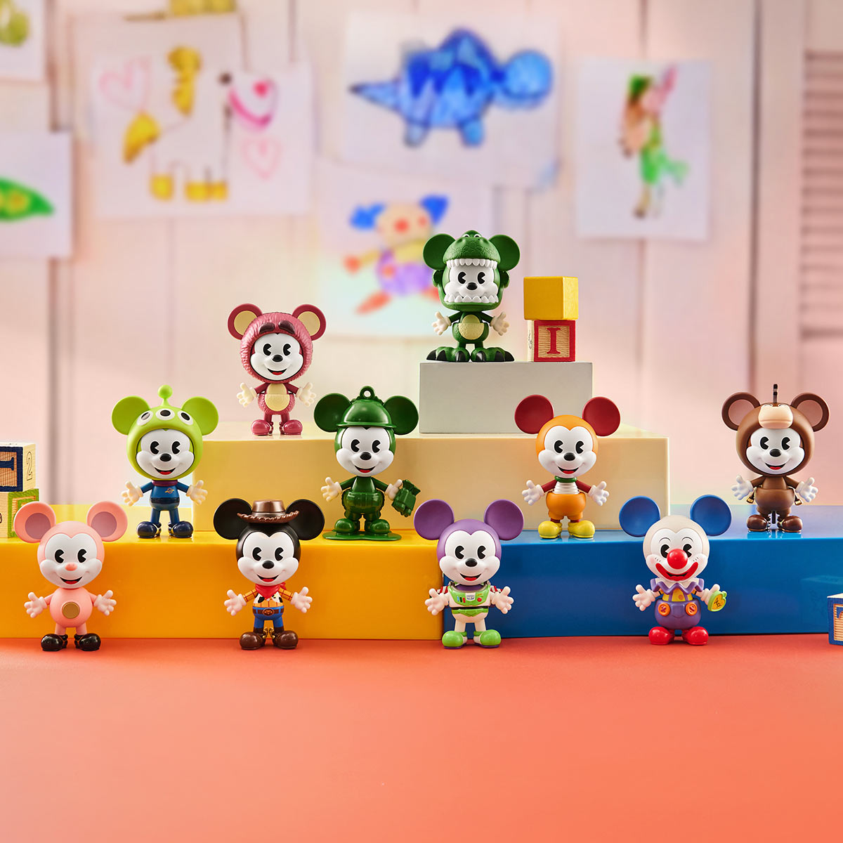 Disney Mickey Remixed: Mickey Meets Pixar Series Figures showcase collectible Mickey vinyls in various Pixar-inspired costumes, displayed on tiered blocks. Preorder for January 2026.