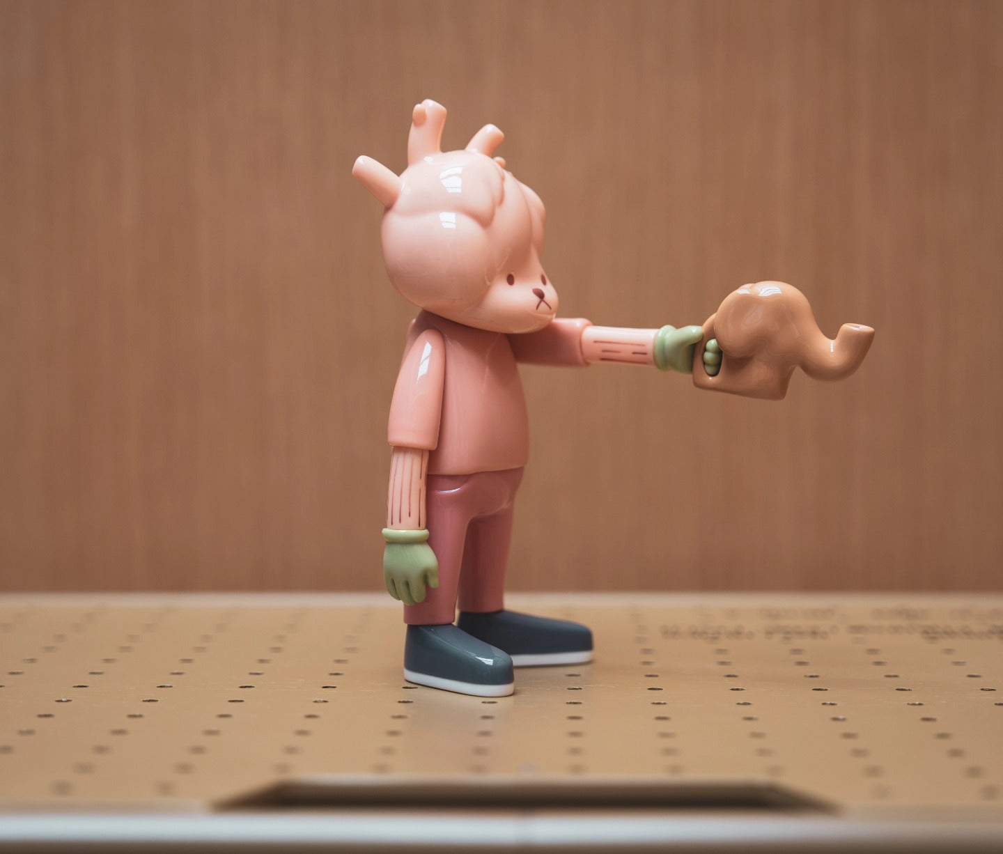 A blind box figurine, KOKORO florists ver. by JD Wang, vinyl+magnet material, 18.3cm. Captures a toy figurine holding an elephant.