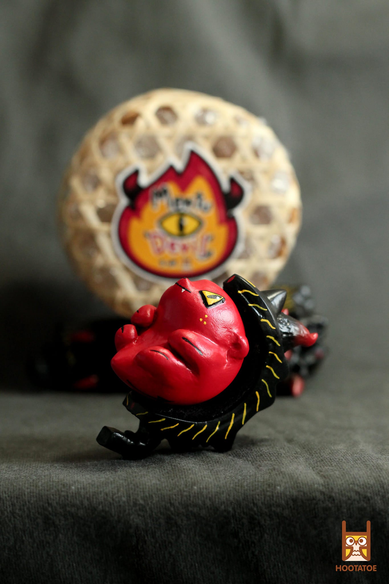 Thailand All-Stars - Mentu Devil by Hootatoe, a resin and magnet figurine featuring a stylized red and black design with yellow eyes.