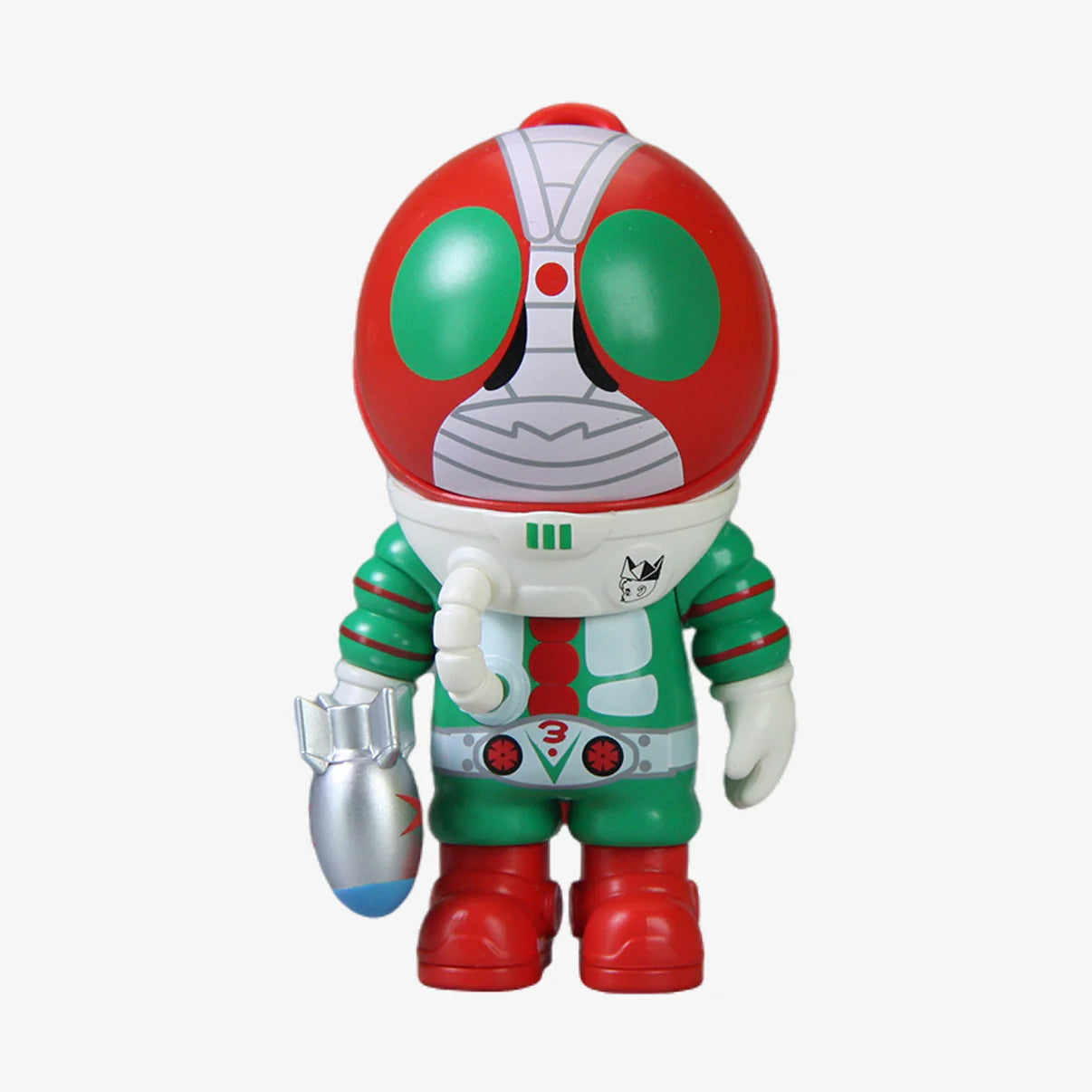 SAMSAM ADVENTURER X KAMEN RIDER BLIND BOX: Bug-eyed astronaut figure in a red-green suit, holding a silver rocket accessory. Part of a collectible series.