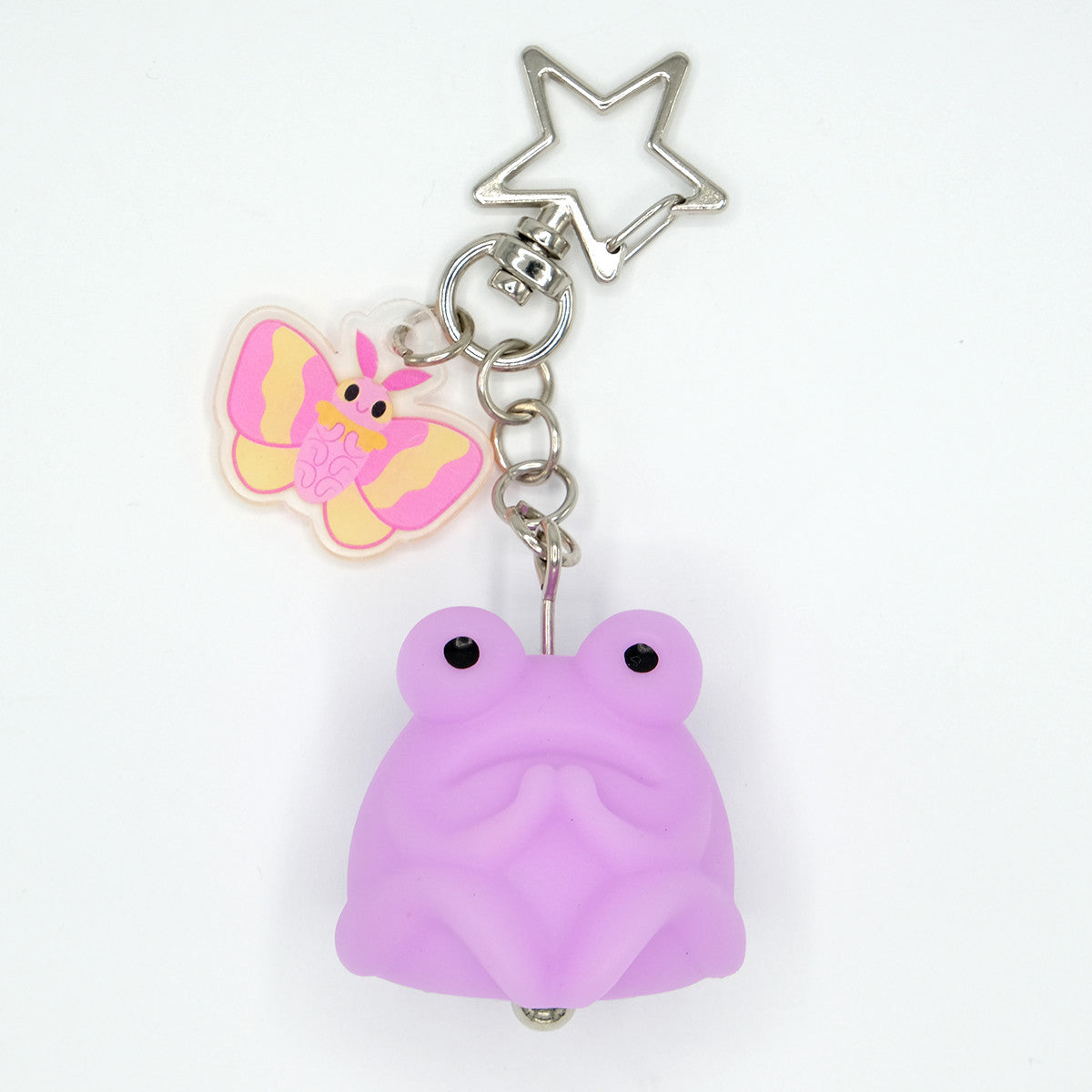 Fruggie the Toad Bag & Key Charms by Horrible Adorables, featuring a glow-in-the-dark vinyl toad and acrylic butterfly charm with a silver star-shaped clip.