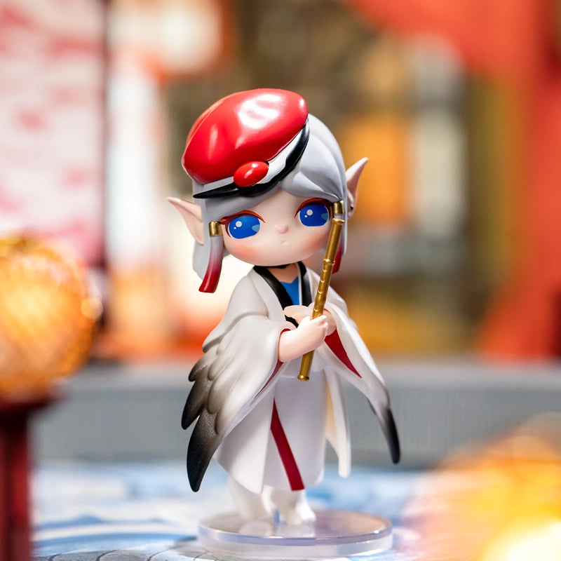 Chibi-style elf figurine from Paradise Guardians Blind Box Series, featuring large blue eyes, pointed ears, and a kimono outfit, holding a golden flute.