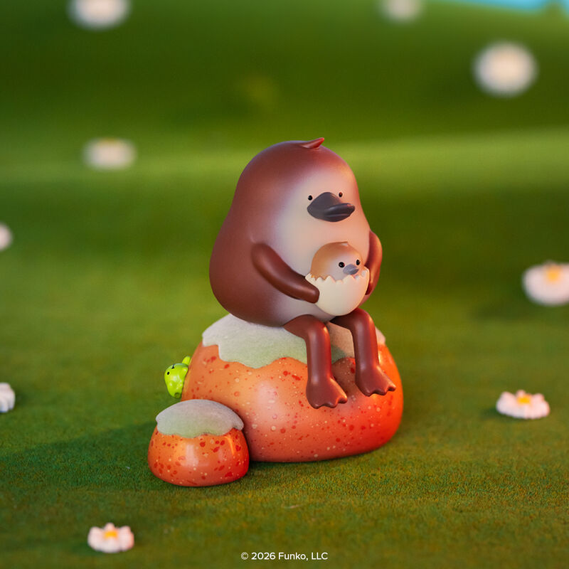 Blonks Animal Afternoon Premium Blind Box by Sad Salesman: Brown bird-like vinyl figure cradling a chick, atop an orange rock with a green frog.