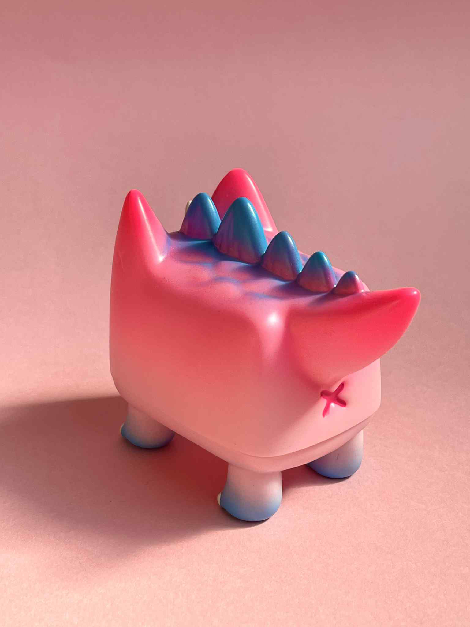 DiDi (Dino cat) Pink by Rato Kim, a 6.5x7.5x5.7cm limited edition sofubi figurine, featuring a block shape, spikes, and pointy ears.