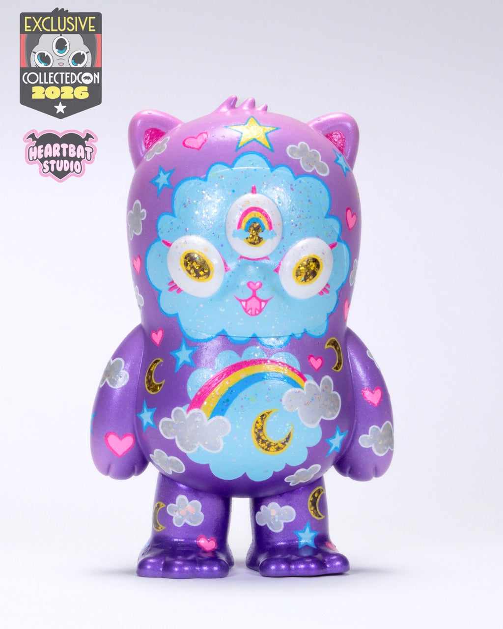 Beans Group Show - Care Beans by Heartbat Studio x Josh Divine, a 5 vinyl toy with whimsical motifs, preorder for May 2026 release.