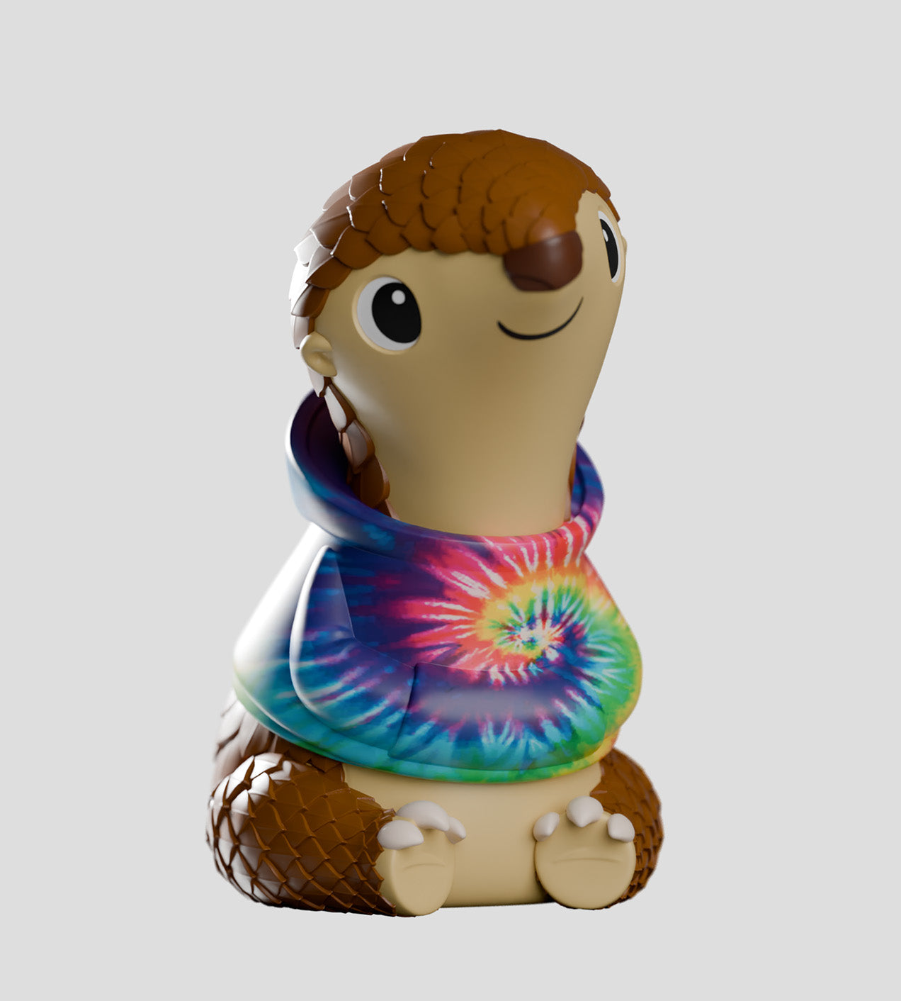 Cosmo, a cartoon pangolin figurine, wears a tie-dye shirt, embodying adventure and shyness, part of Strangecat Toys' unique art toy collection.