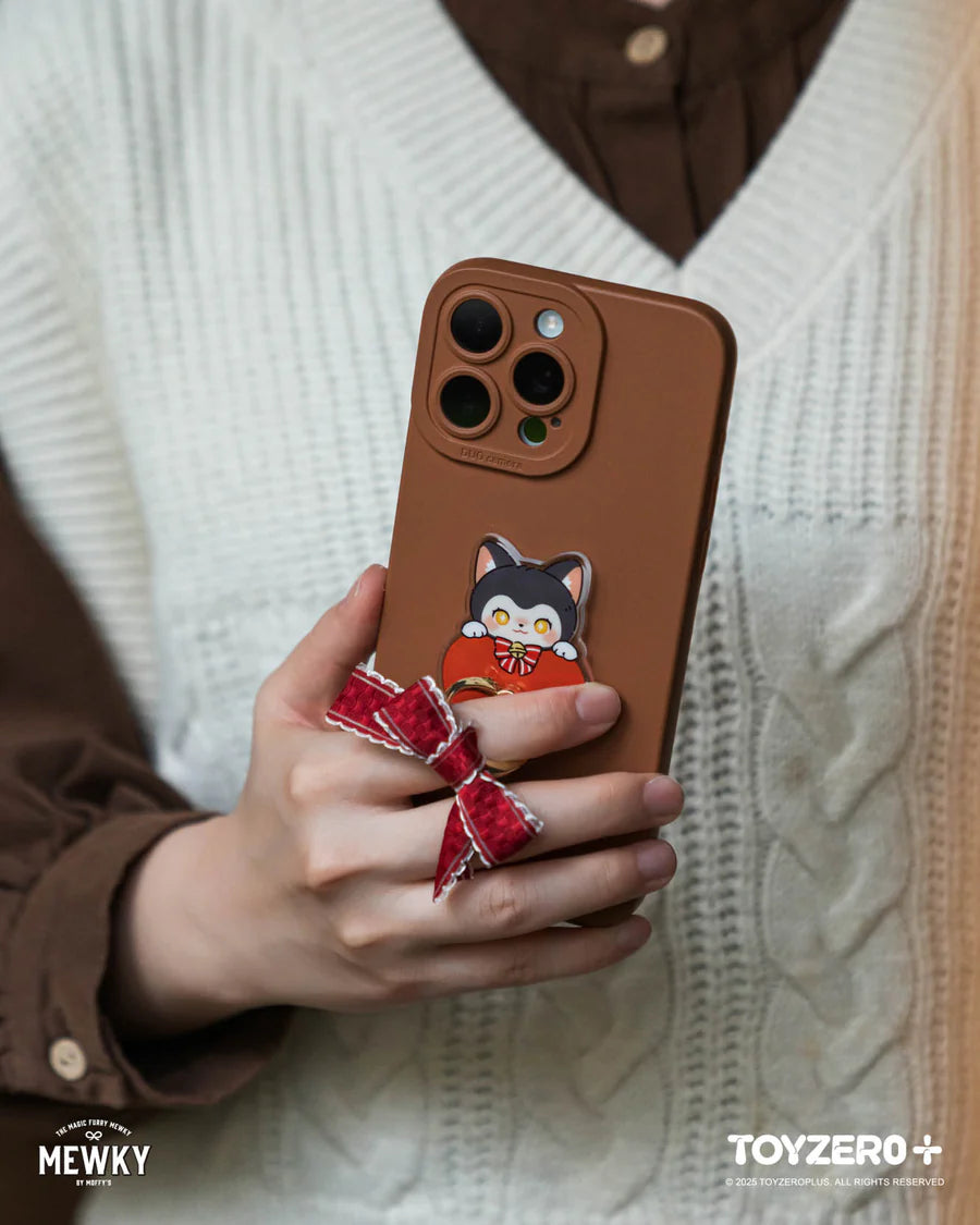 Moffy's - Mewky Phone Ring Holder features a black cat pop-grip on a matte-brown case with a red plaid bow, enhancing your phone's charm.