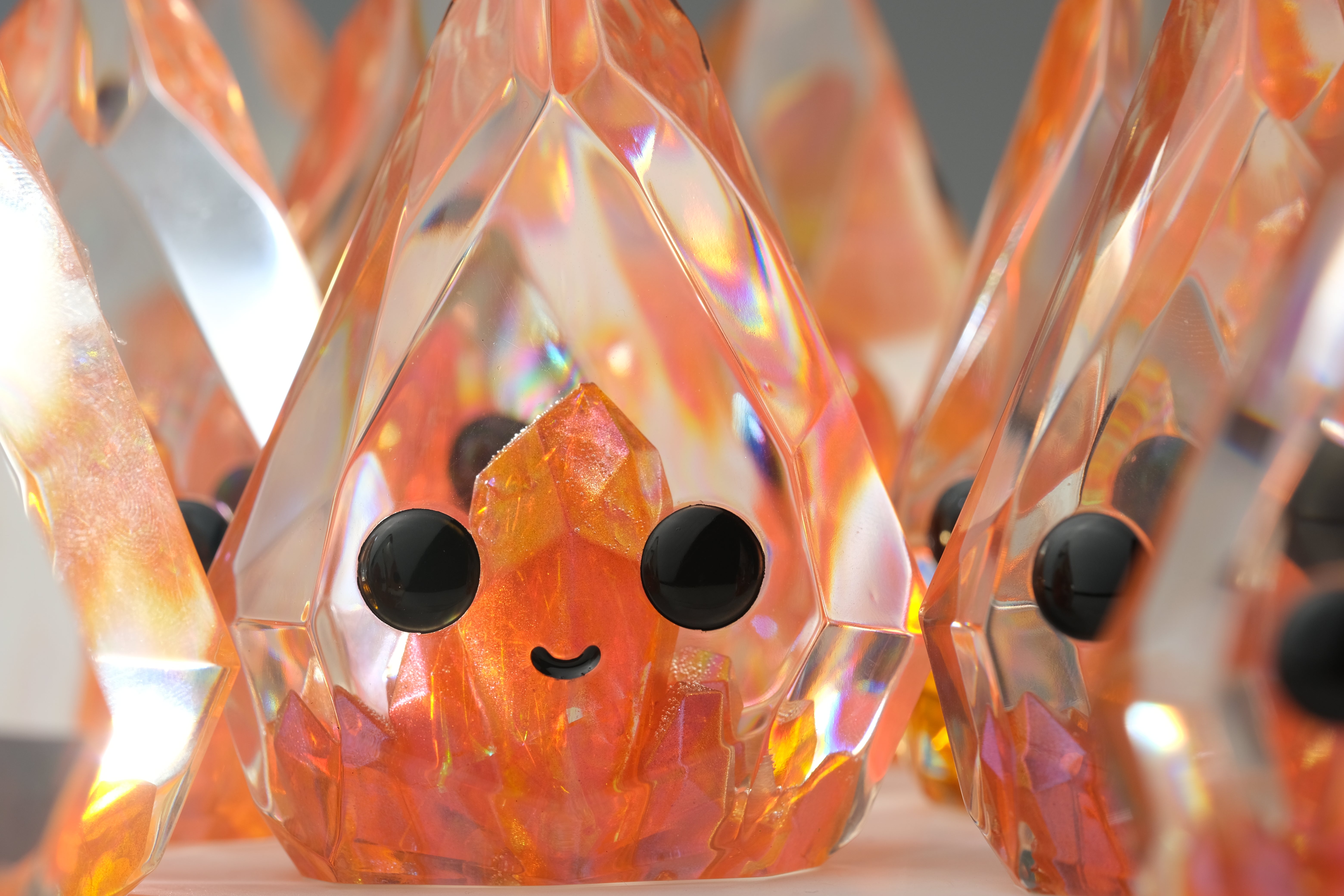 Fire Opal Prismite by Yutoos: A 3.5 resin art toy featuring intricate fingerprint-like patterns, limited edition of 50, highlighting its unique indoor decorative appeal.