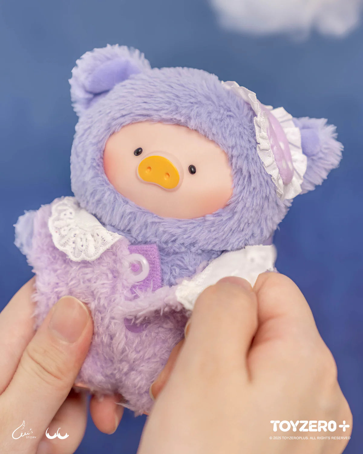 LuLu the Piggy collectible in lavender outfit, featuring bear ears and button details, from LuLu's Dreaming Wonderland Series PVC Plush Keychain Blindbox by ToyZero+.