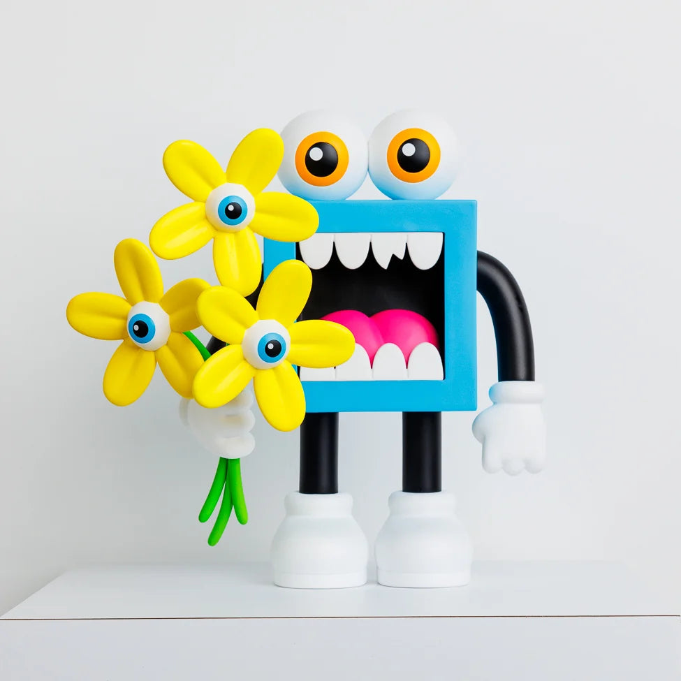 FRESH PICK VINYL FIGURE by Greg Mike features a toy figure holding flowers, showcasing a playful design typical of art toys from Strangecat Toys.
