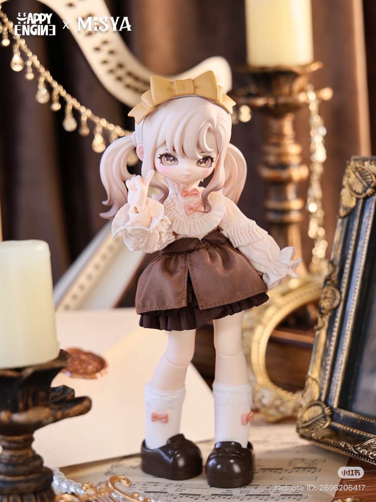 Collectible MISYA doll in ruffled blouse, brown skirt, with anime eyes and pigtails, surrounded by vintage props, from Happy Engine × Misya collaboration.