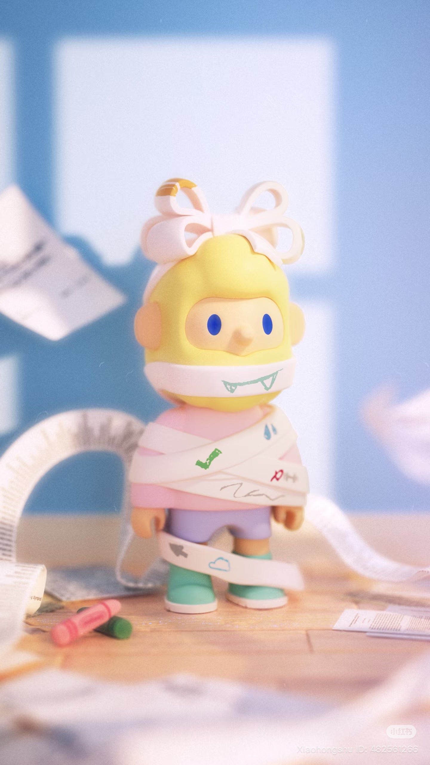 Farmer Bob Flash Back Blind Box Series toy figure with a bow and sneakers, wrapped in doodled paper strips, on a tabletop with crayons.