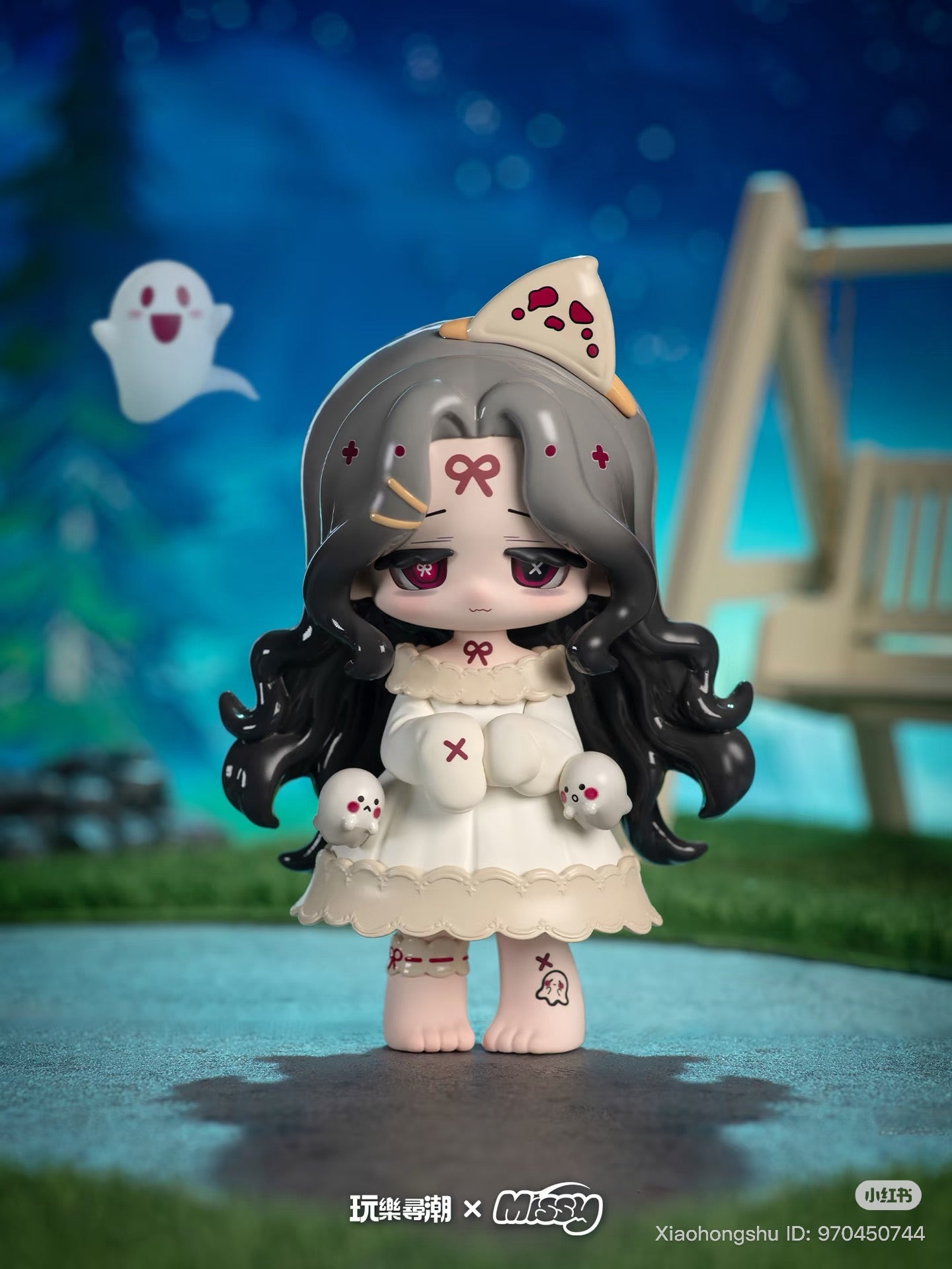 Chibi-style vinyl figure MISSY: Sweet-Gothic Lolita Crow Paradise with long gray hair, ghost decals, and pizza hat, in an outdoor diorama at dusk.