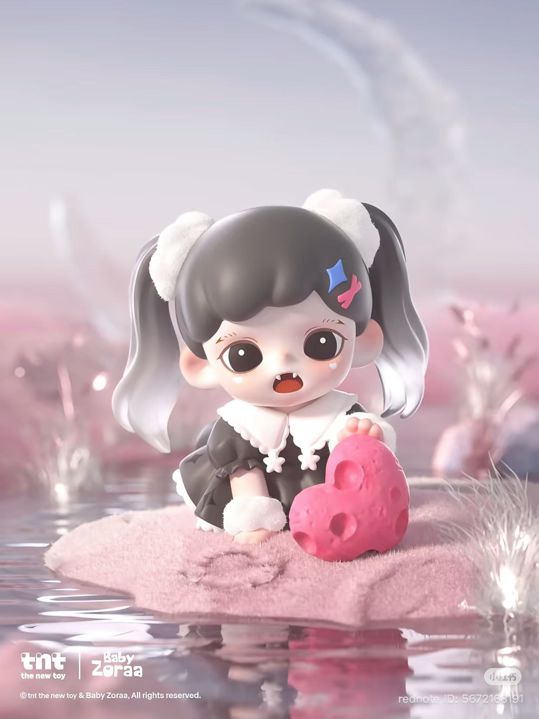 Chibi-style Baby Zoraa kneels on pink sand, holding a heart-shaped rock. Part of the Zoraa Starry River in Memories series figures Blind Box.