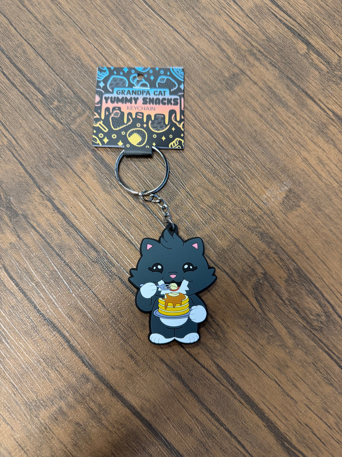 Grandpa Keychain - Japanese Snack Series: Cartoon cat with pancakes on a backing card, highlighting snack-themed novelty from Strangecat Toys.