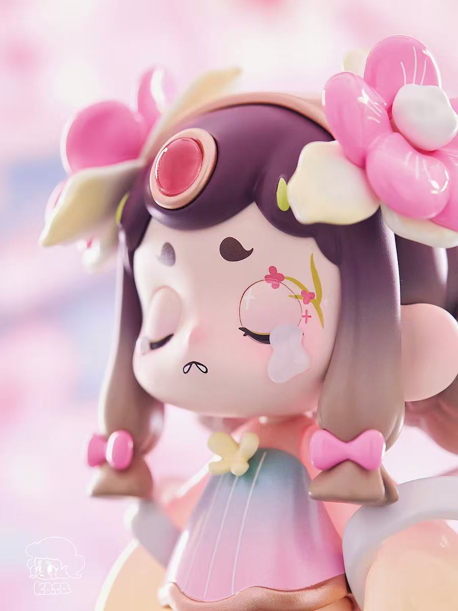 KASA 2.0 - Mystic Tales Blind Box: Chibi-style girl figurine with pastel hues, jewel on forehead, pigtails, closed eyes, and butterfly-accented dress.