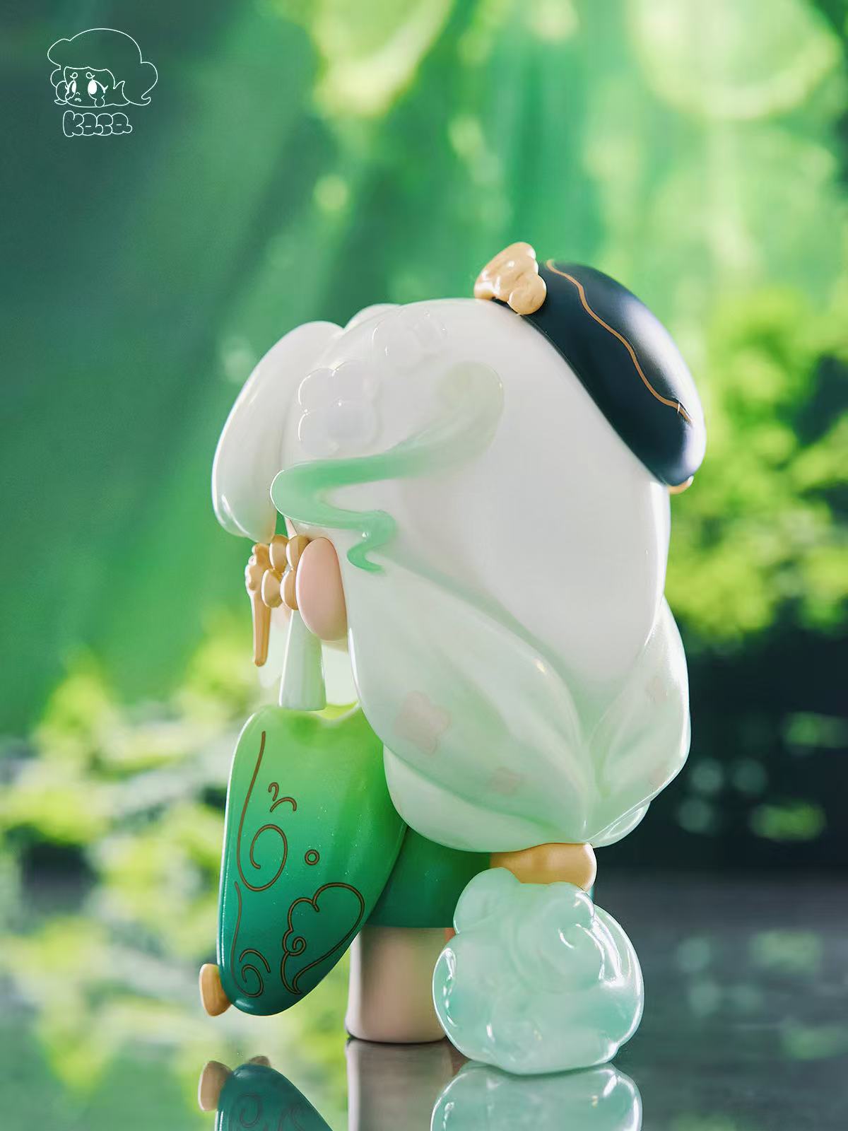 KASA 2.0 - Mystic Tales Blind Box Series: Designer figurine with translucent hair, gold accents, and cloud motifs, standing elegantly on a glossy surface.
