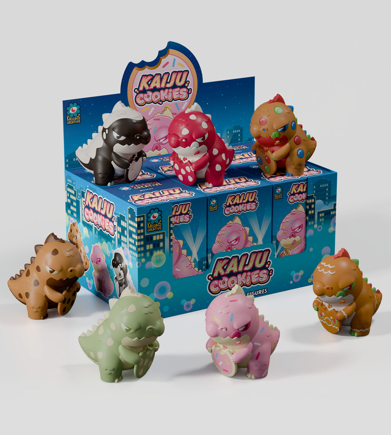 Kaiju Cookies Blind Box features chibi monster-dinosaur vinyl toys styled like cookies, each holding a matching treat, displayed in a bright city-skyline box.
