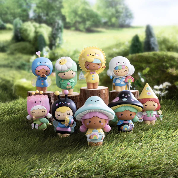 Magical Meadow Momiji Dolls Blind Box Series: Chibi vinyl figurines in whimsical hats, displayed on grass and stumps, each with hidden fortunes and collectible extras.
