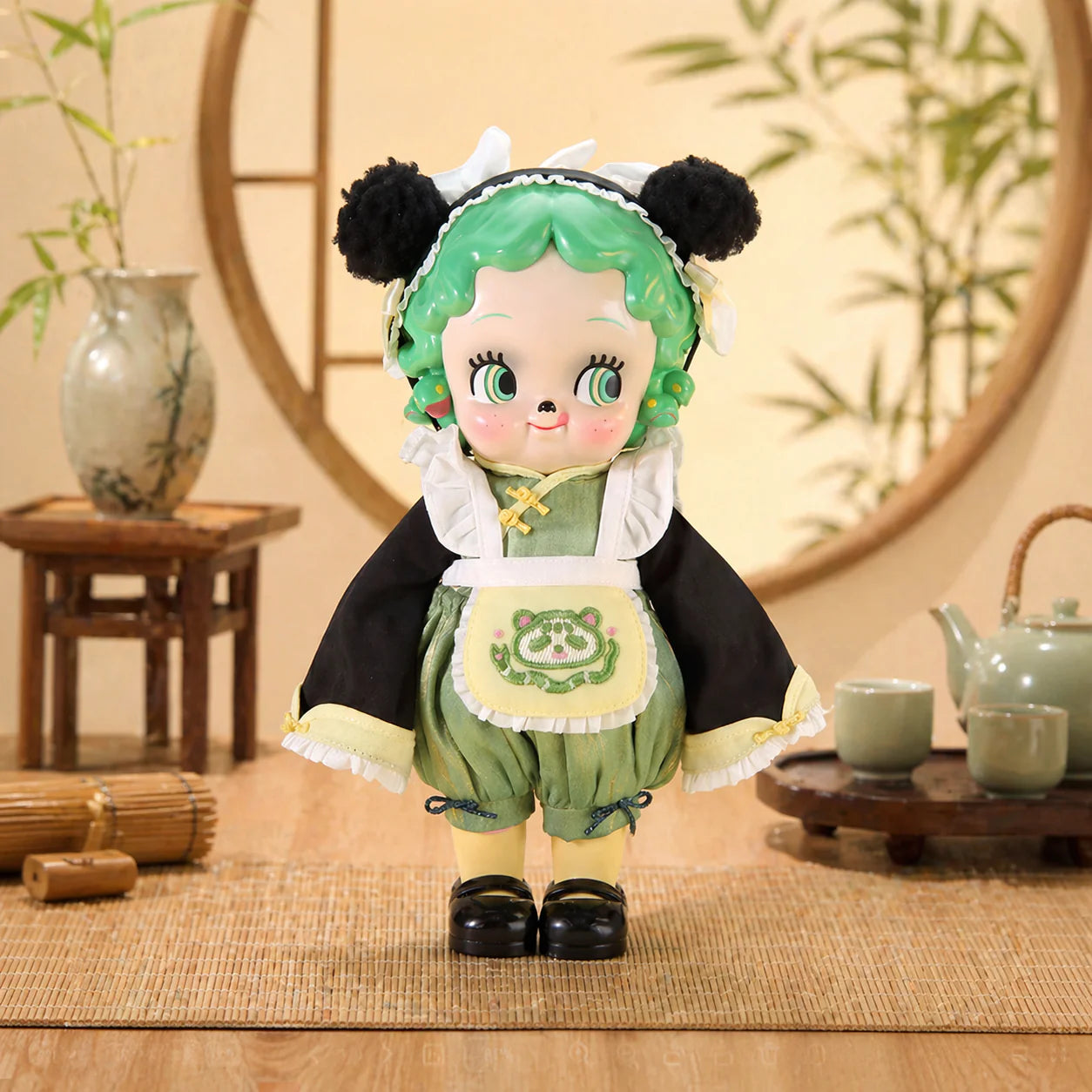 ABAO Medusasa (Panda ver.) Sofubi Figure - Preorder: A whimsical vinyl doll with ringlet hair, panda ears, and a tailored outfit, standing on a woven mat.