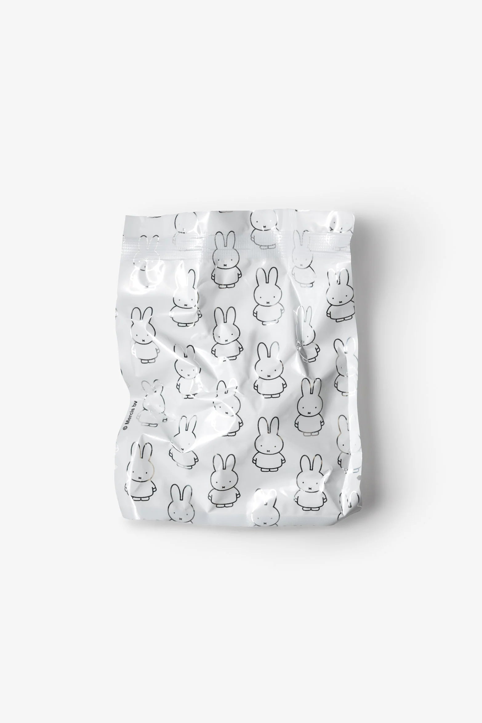 Smoko Miffy Dressing Up Blind Box Figure in a resealable pouch, featuring a repeating Miffy bunny motif, containing one surprise collectible vinyl figure.