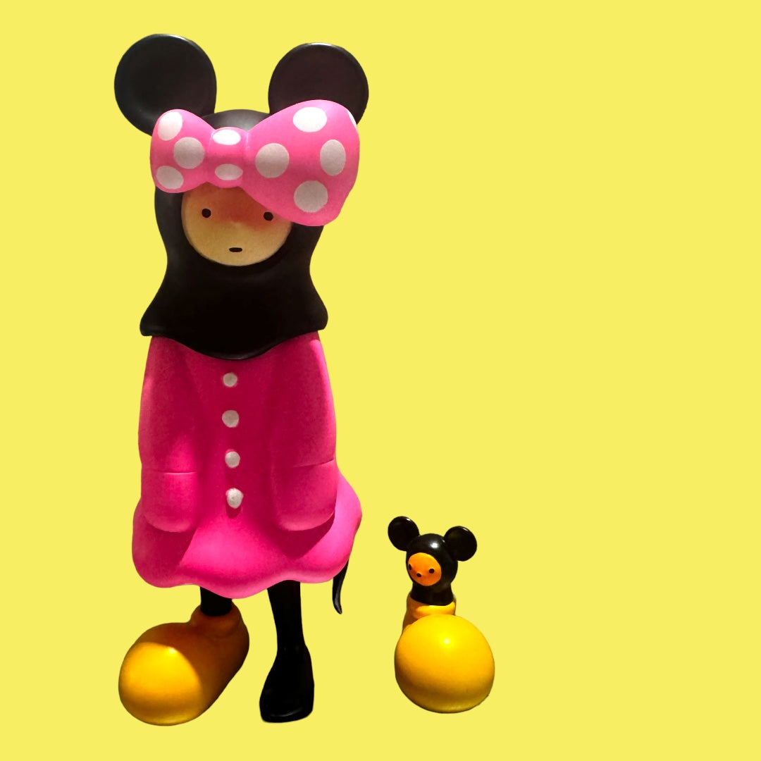 Toy figurine of a girl with a duck and a yellow ball, part of Sosim MINNIE NIAR by JIBI collection.
