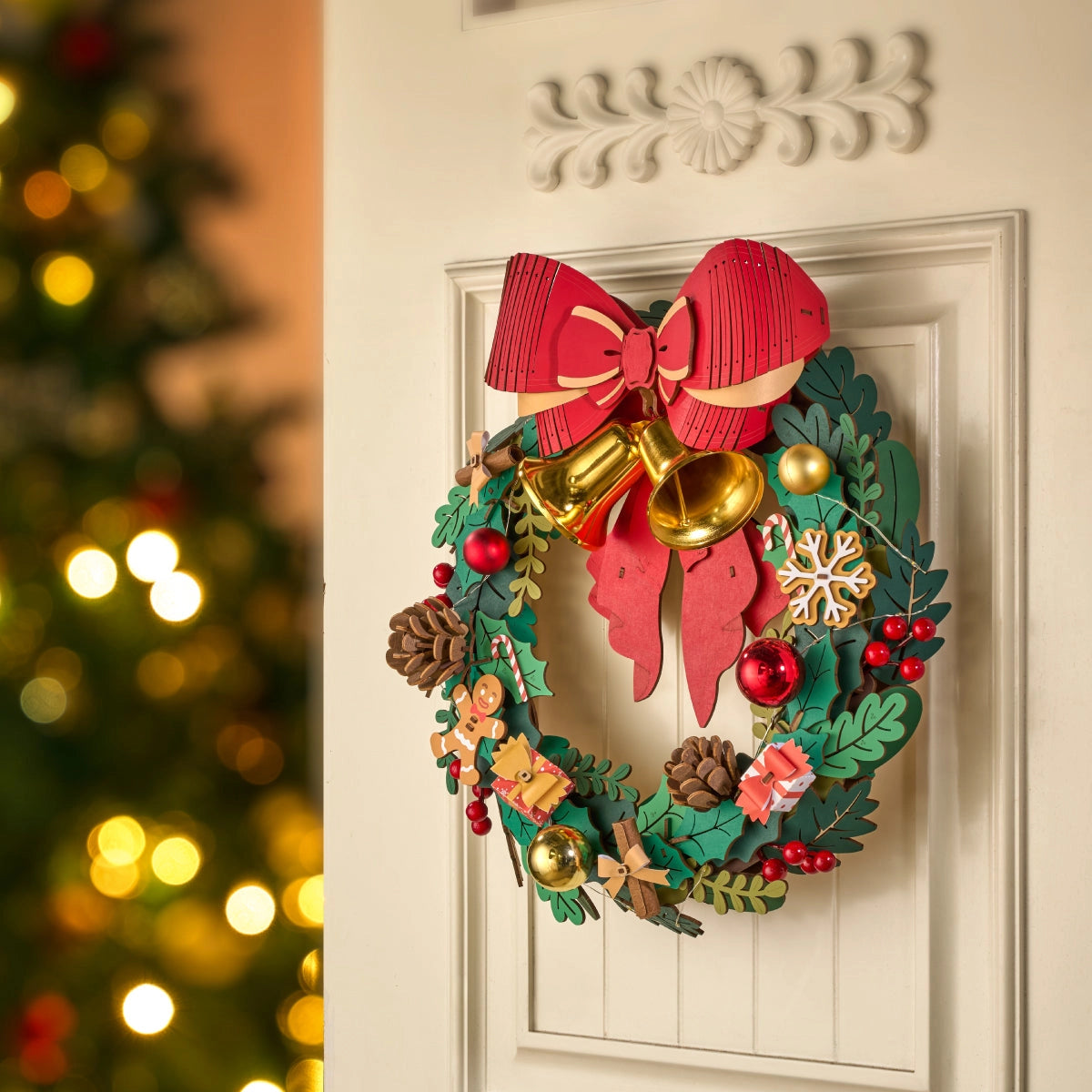 Rolife 3D Wooden Puzzle - Christmas Wreath TGL04: A festive wreath with a red-and-gold bow, bells, berries, and ornaments, perfect for creating holiday magic.