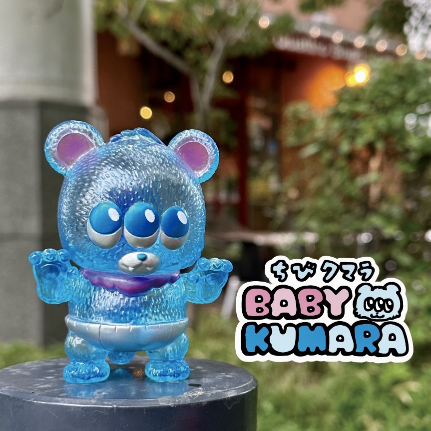 Baby Kumara - CollectedCon Edition by MoMoo Kuma, a limited-edition sofubi toy bear with three eyes, measuring 6.5x7.5x5.7cm.