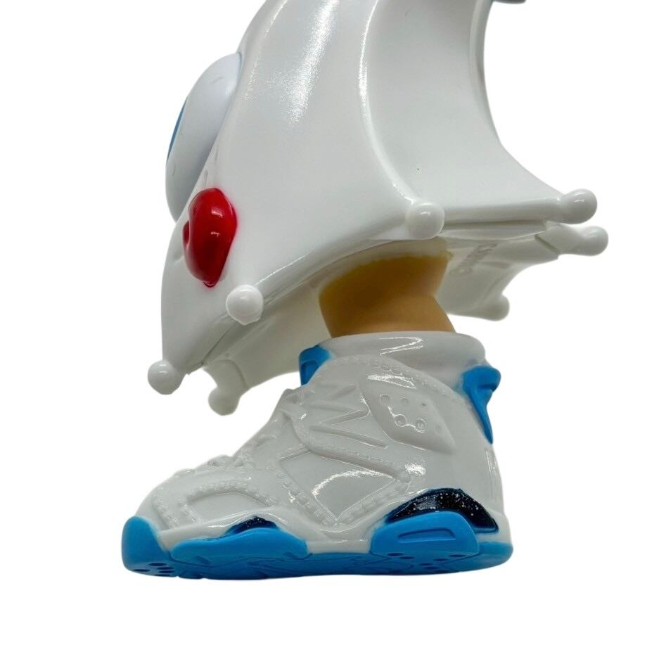 Kick Specter - white by MARK's collectible figure showcasing a sleek, glossy helmet and stylish sneakers, embodying the unique artistry of Strangecat Toys.