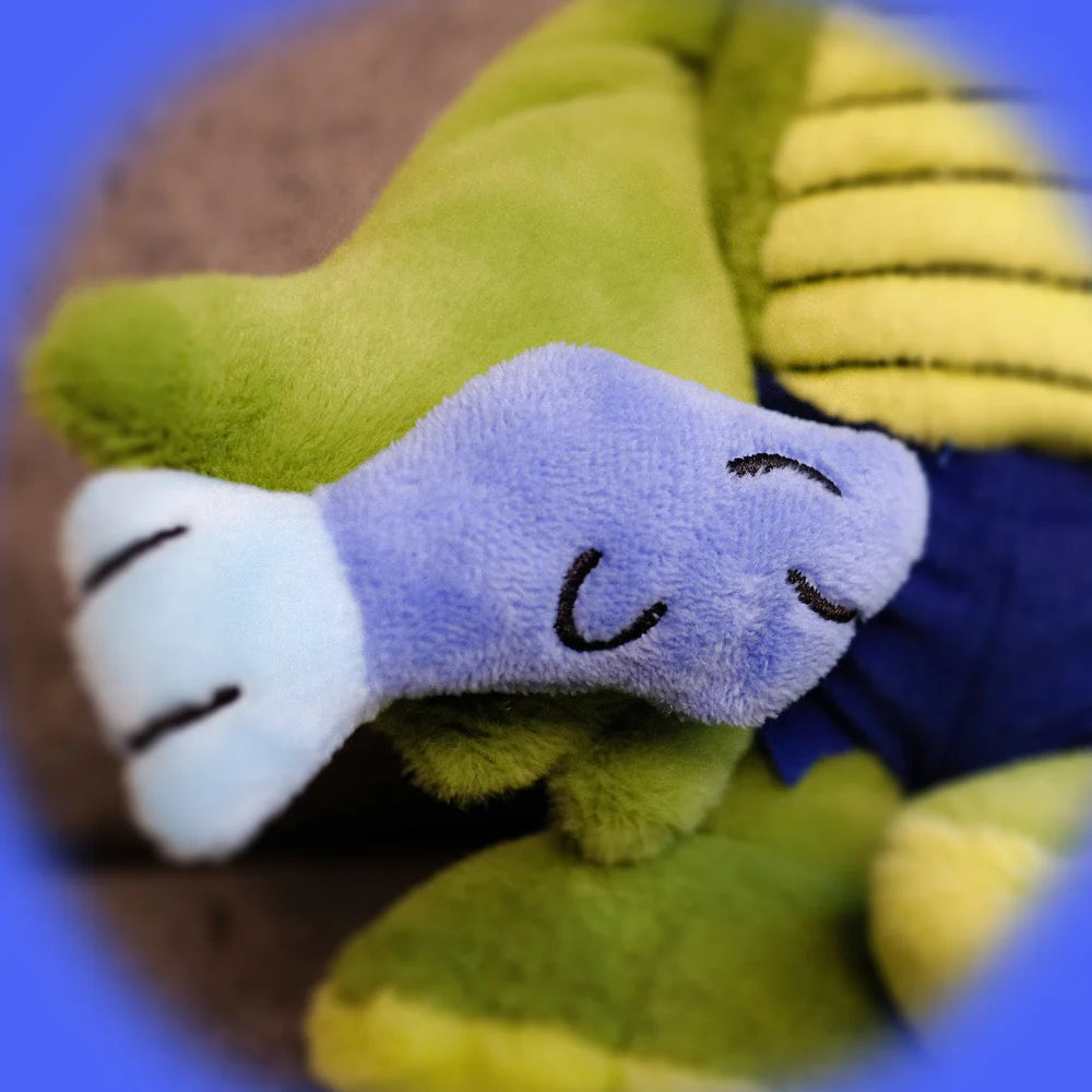 Monkay + Alligator Plush by Life Machine: A soft, green dragon-like toy with yellow ribbed belly, embroidered face, and magnetic accessory. Suitable for ages 0+.