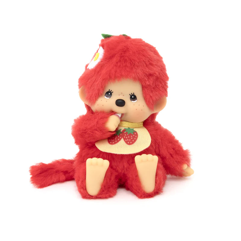 Monchhichi Fruit Beanies Plush with red fur, cartoonish face, and strawberry-themed details, seated with thumb-sucking pose. 5.5 cuddly character toy.