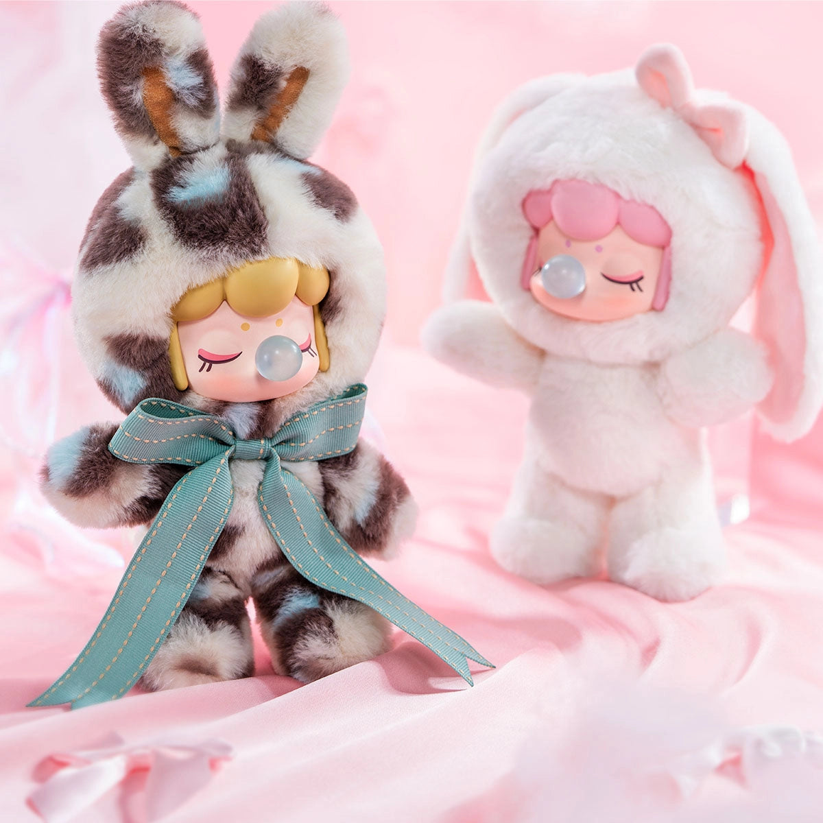Nanci's Shining Bunny Plush Blind Box featuring a close-up of a stuffed animal with a bow, part of a collectible blind box series.