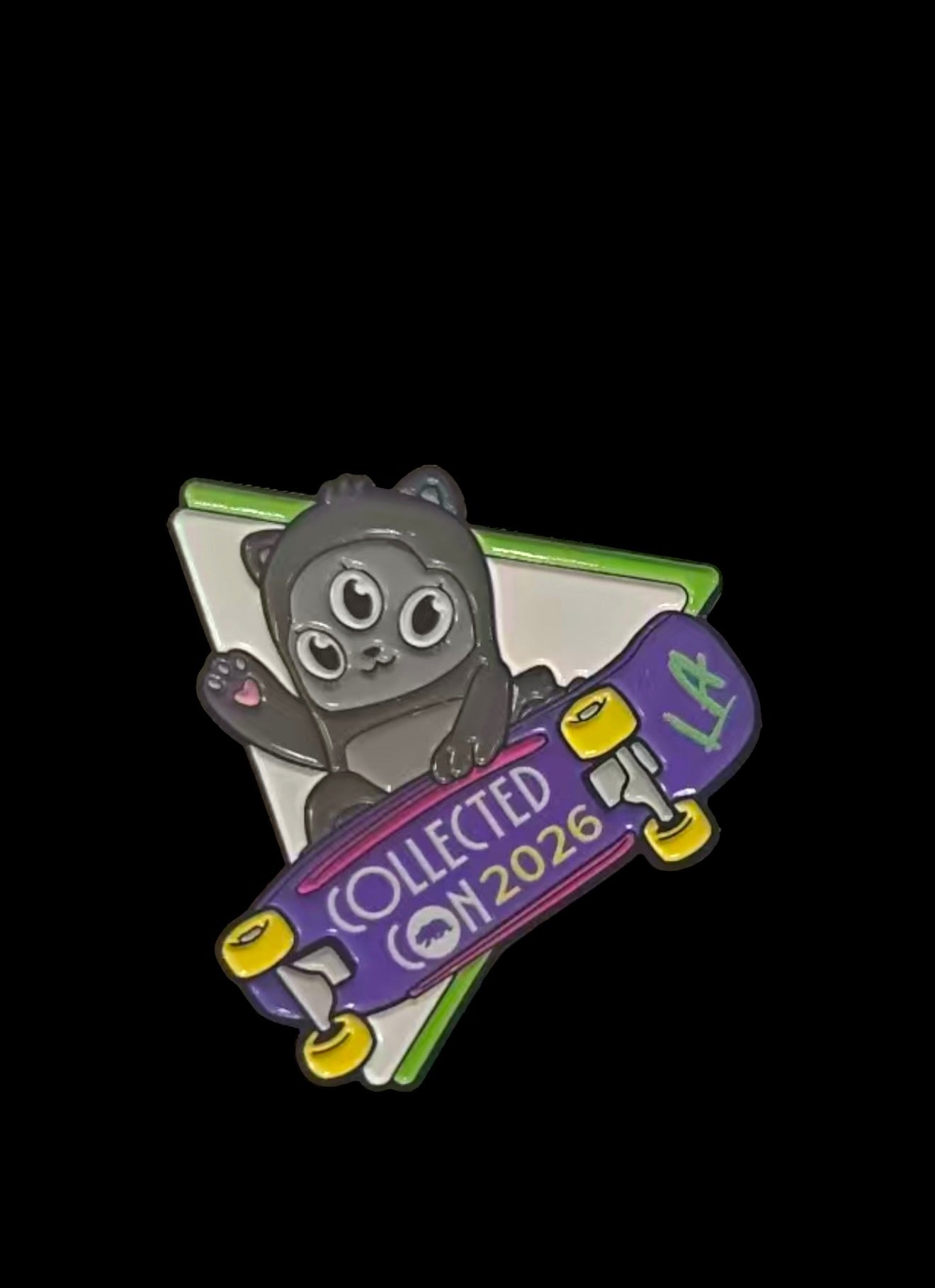 CollectedCon LA Pin - Preorder: A three-eyed black cat on a skateboard, waving with a heart on its paw. Features LA and COLLECTED CON 2026 text.
