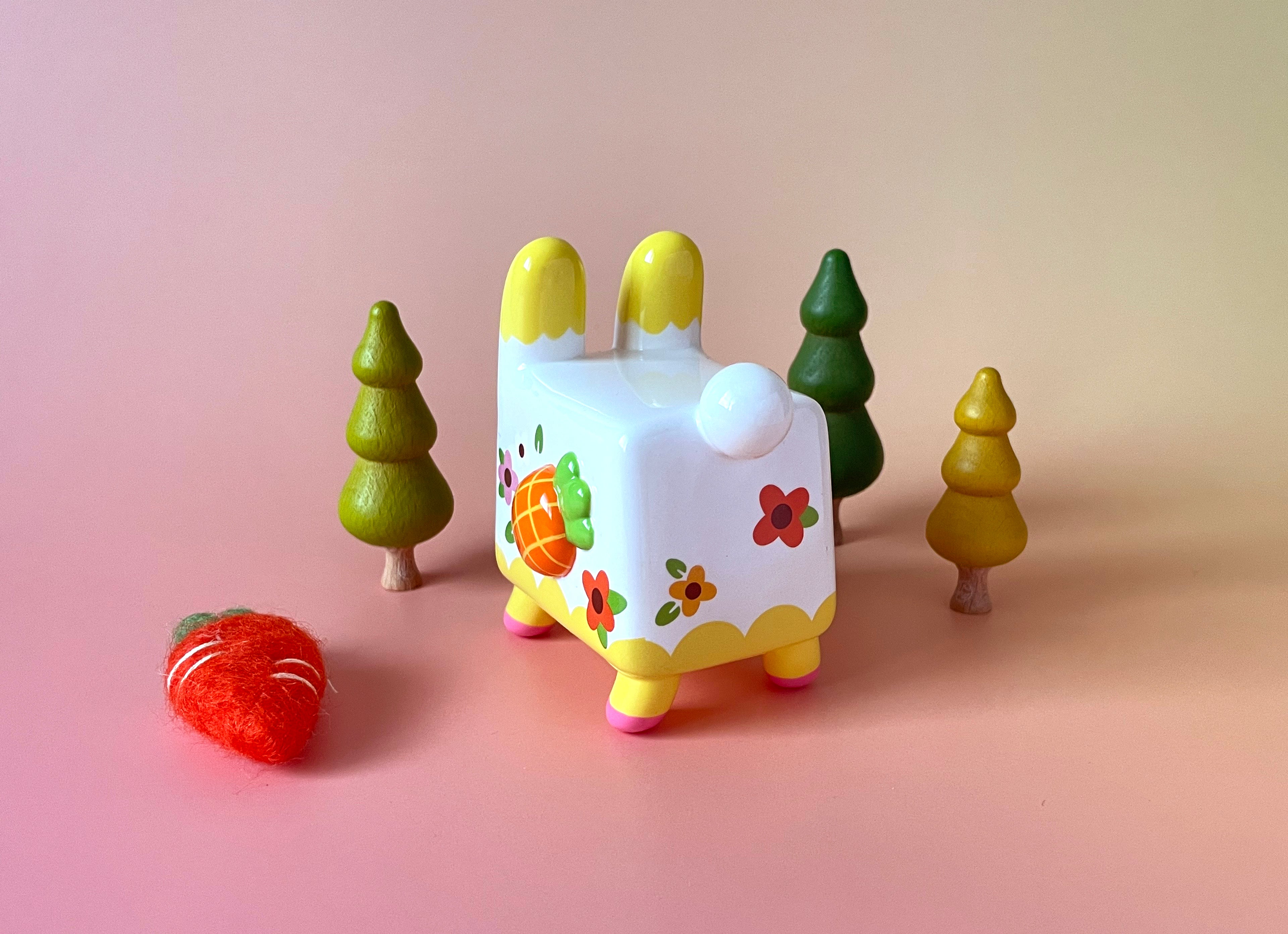 Box Rabbit by Rato Kim: A 4-inch soft vinyl toy featuring a rabbit with floral and fruit designs. Limited edition of 100 pieces.