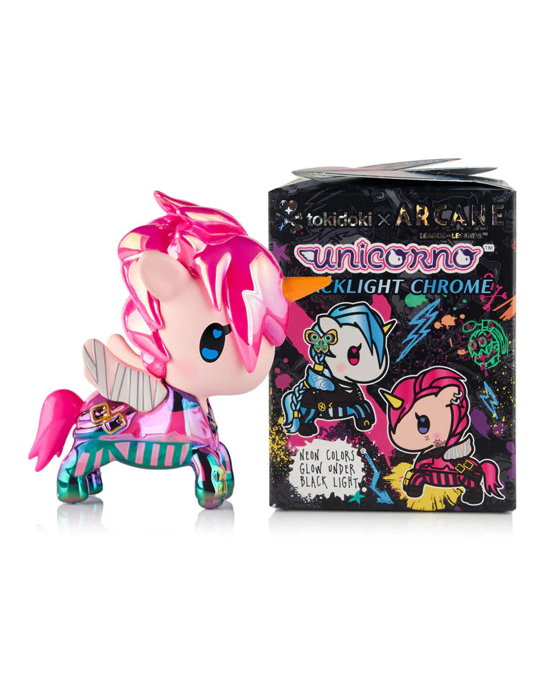 Tokidoki x ARCANE Unicorno Black Light Chrome Blind Box figure with pink chrome finish, posed before matching neon-splashed box, collectible art from Strangecat Toys.
