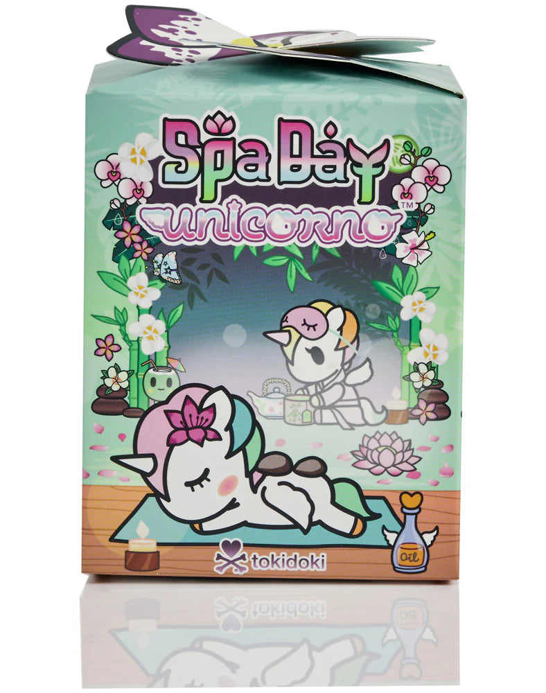 Spa Day Unicorno Blind Box - Preorder, featuring a Tokidoki unicorn on a spa mat with zen elements. Blind box includes one surprise figure and accessories.