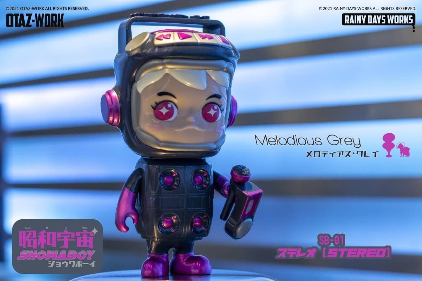 Toy figure with pink and purple head, pink eyes, and a face, part of SHOWA UNIVERSE - The SHOWABOY! SB-01 STEREO by Rainy Days Works.