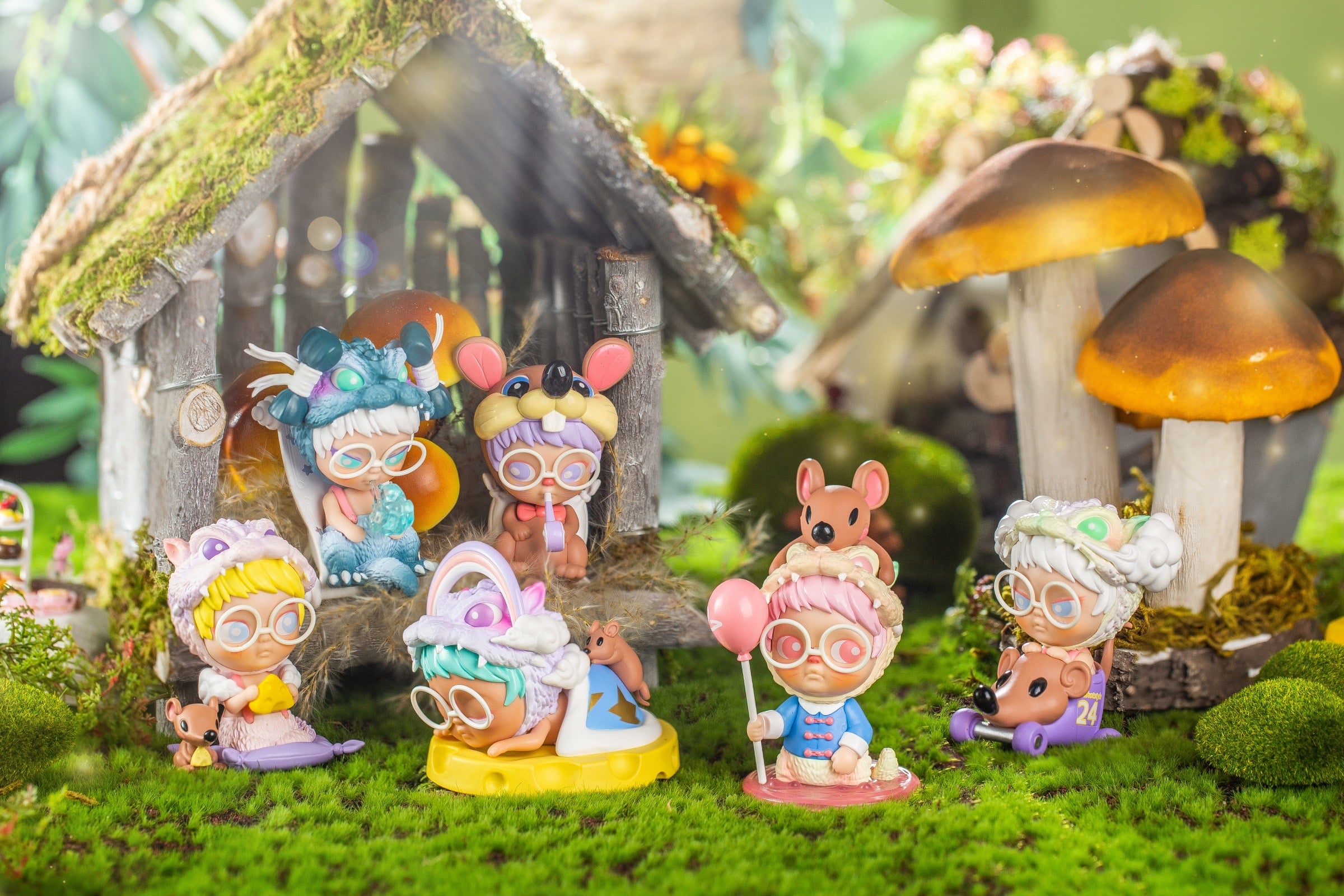 Toy figurines from The Little Puff Dream Country Series Chapter One by Red Hot Style, each with an enamel pin, outdoors on grass with a mushroom.