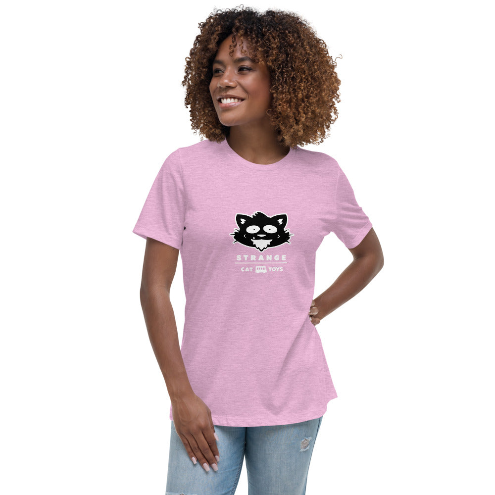 A woman wearing a pink shirt with a black cat.